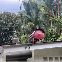 An antenna mounted on a roof, linking the venue