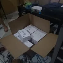 A carton full of boxed access points for a school Wi-Fi project